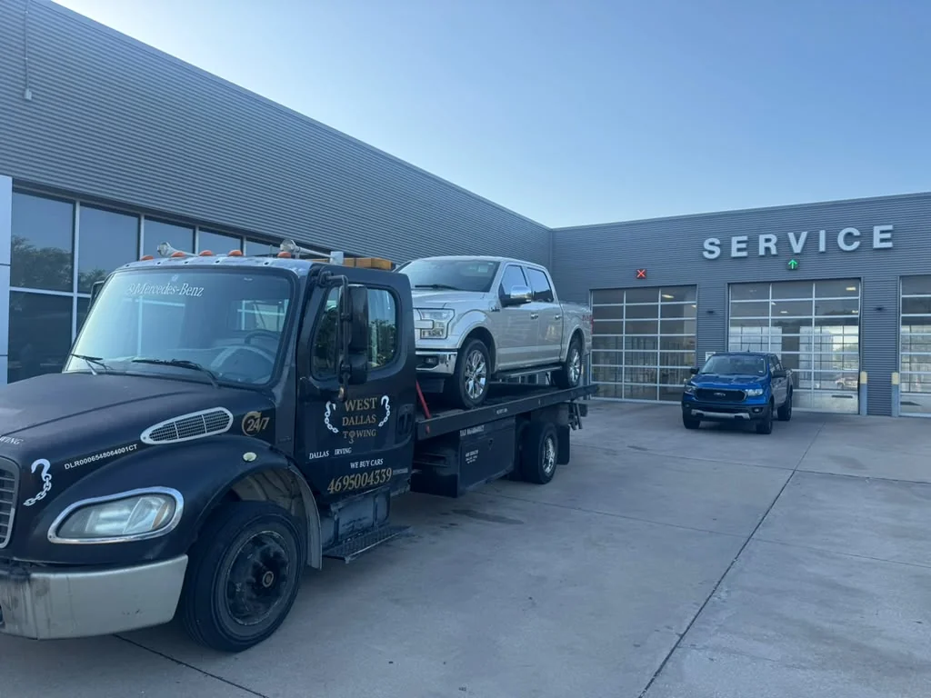 West Dallas Towing delivering Ford F-150 to dealership service bay in Coppell Dallas