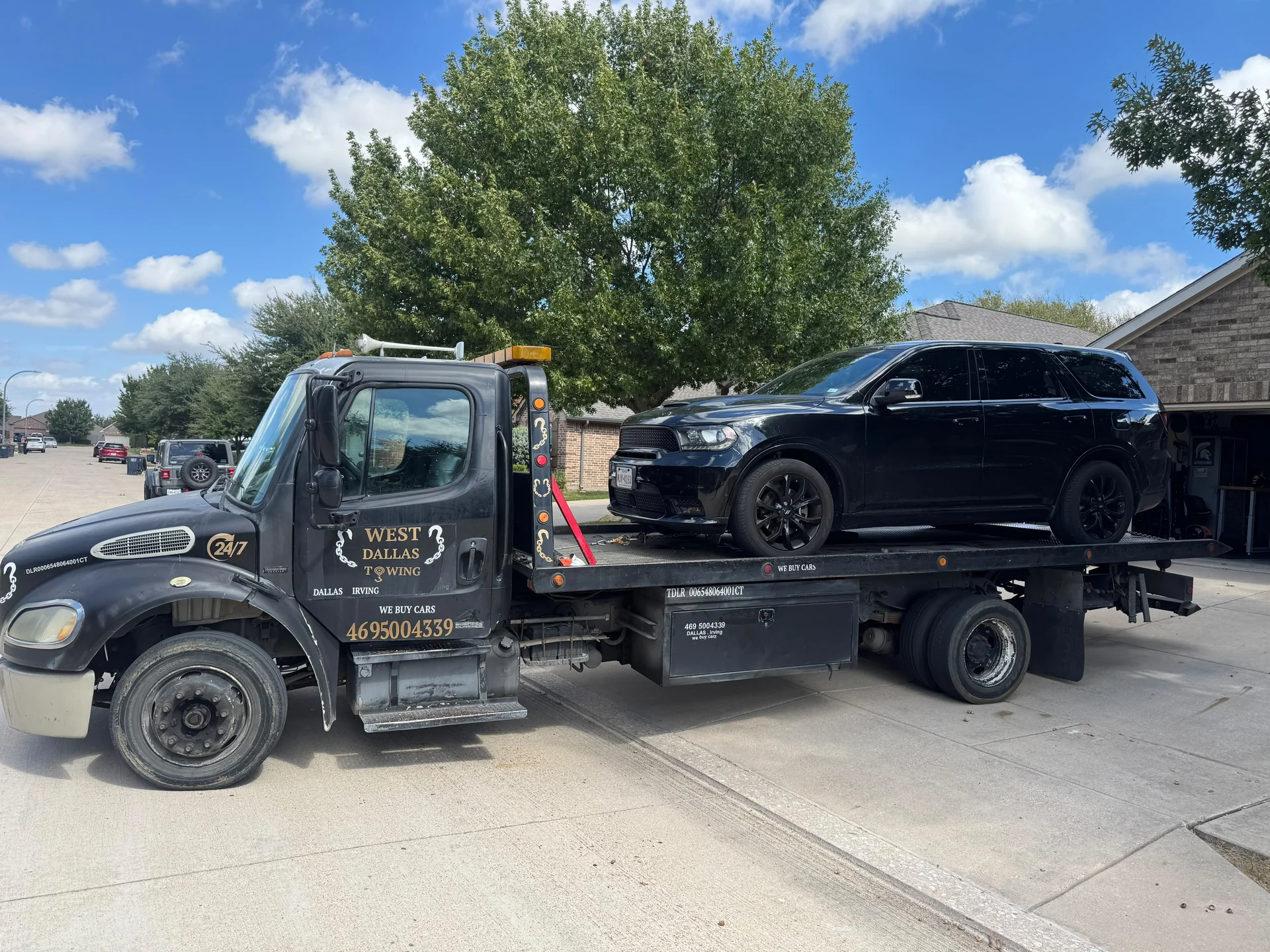 West Dallas Towing - 24/7 Towing Service Irving TX West Dallas Towing flatbed tow truck in Irving TX residential neighborhood